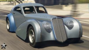 Vue avant de la voiture Truffade Z-Type dans GTA Online, elle est couleur grise pour la peinture principale et bleu pour la secondaire