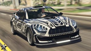 La voiture Obey 8F Drafter vue de devant, elle est de floqué du motif "Val-de-Grâce" et est de couleur blanche et noire.