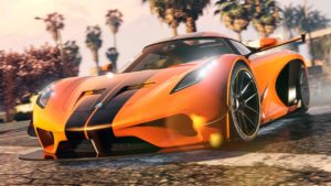 Vue avant de l'Överflöd Entity MT dans GTA Online, le véhicule est de couleur orange et dispose du motif "Doubles bandes noires" appliquée sur sa carrosserie
