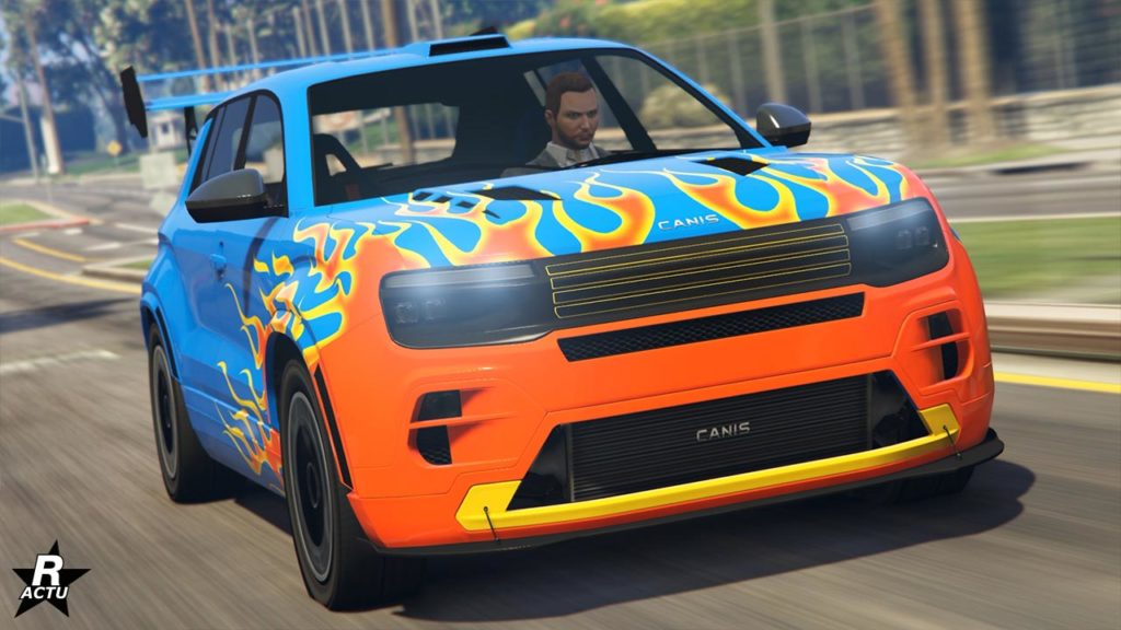 Vue avant du SUV Canis Castigator dans GTA Online, le véhicule est de couleur bleu ultra et a une décalcomanie de flammes oranges géantes sur le capot.