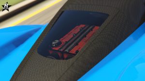 Vue rapprochée du capot arrière d’une voiture de sport Dewbauchee Vagner bleue du jeu vidéo GTA Online. Le capot présente une texture en fibre de carbone et dispose d’une fenêtre en verre rectangulaire à travers laquelle le bloc moteur rouge du véhicule est visible. Ce détail est intéressant car il met en valeur le moteur haute performance de la voiture et ajoute à son attrait esthétique, soulignant le mélange de luxe et de puissance dans la conception automobile.”