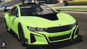 L’image montre une voiture de sport vert vif, le véhicule se nomme “Ubermacht Niobe”. Il s'agit d'une vue de l’avant. La voiture présente un design distinctif avec une calandre élaborée, des phares élégants et une forme aérodynamique avec des ouvertures sur le capot et les côtés. Le véhicule est représenté en mouvement sur une route de GTA Online.