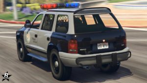 La véhicule Bravado Dorado Cruiser vue de derrière, elle est de couleur grise et noire.