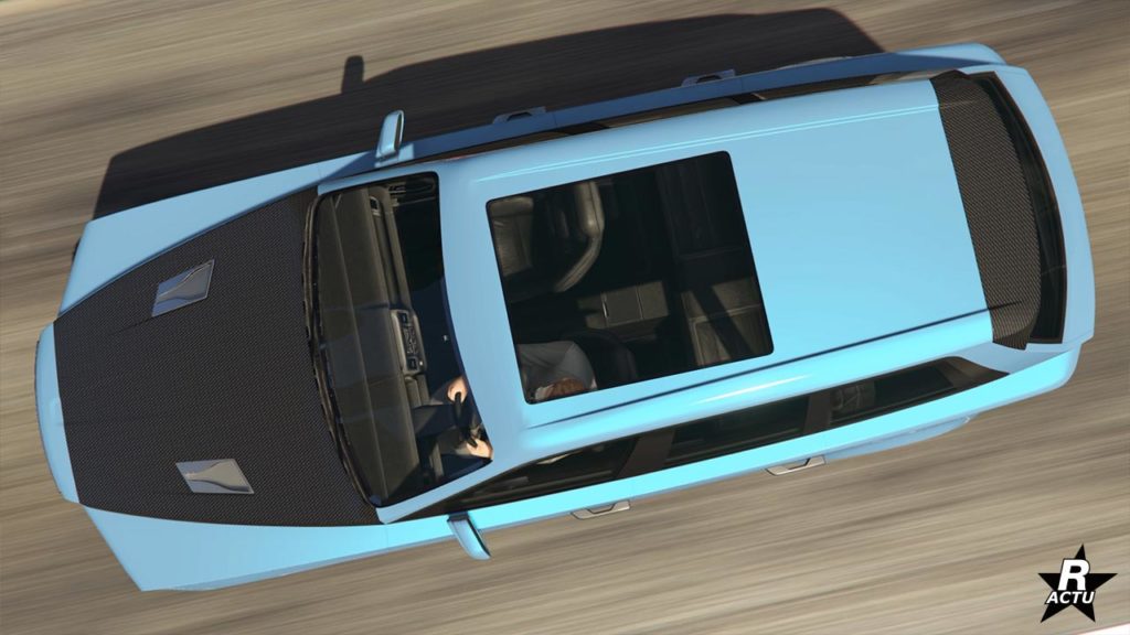 Vue présentant l'Enus Jubilee vue de dessus. La voiture est peinte en bleu ciel, son capot se trouve être en carbone et on peut apercevoir l'intérieur du SUV via la fenêtre sur le toit.