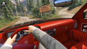 Image du point de vue du conducteur à bord du tout-terrain Declasse Yosemite 1500. Le tableau de bord rudimentaire du véhicule est clairement visible et est de couleur rouge.