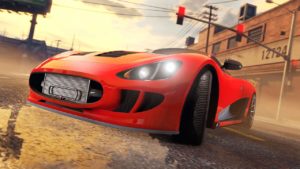 Image de la voiture britannique Ocelot XA-21 dans le jeu vidéo GTA Online. L'angle de vue présente la voiture du côté avant droit. La carrosserie est peinte en rouge.