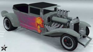 Motif "La mort brutale" présent sur la carrosserie de la voiture d'halloween Albany Fränken Stange. Il s'agit d'un décalco d'un crâne humain orangé qui a une traîné de flammes roses.