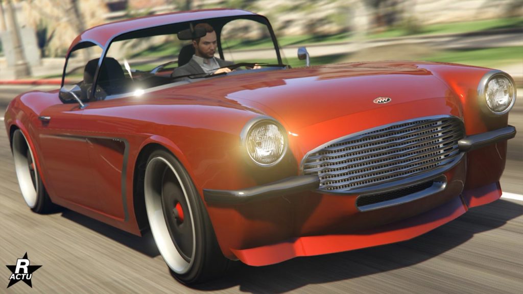 Vue avant du véhicule américain Coquette BlackFin de chez Invetero dans sa version avec toit. Le bolide de collection est intégralement peint en rouge.