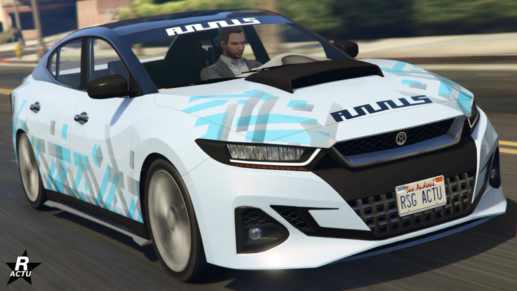 Vue avant de la voiture Annis Minimus dans le jeu vidéo GTA Online de Rockstar Games, elle est peinte en blanc avec une décalcomanie de multiples formes rectangulaires bleu ciel et gris.