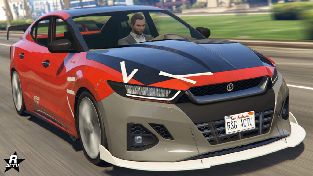 Berline japonaise Minimus dans GTA Online. L'image l'a présente d'une vue avant avec une peinture rouge, ainsi qu'un motif de carrosserie qui ajoute des symboles japonais.
