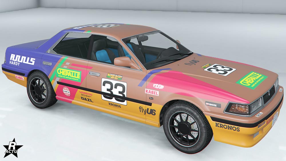 Motif de course de rallye "Spécial terre" appliqué sur la carrosserie. Il s'agit d'un ensemble de forme géométrique de couleurs rose, mauve et vert. Le numéro de course "33" en noir dans un carré blanc apparait également sur les portières et le capot. 