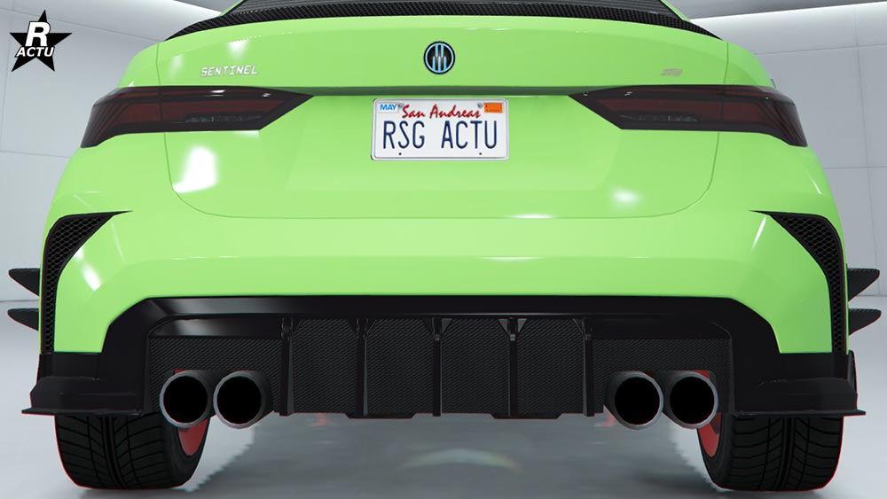 Diffuseur de tuning avec de grandes ailettes latérales et des moustaches de course sur le pare-chocs arrière.
