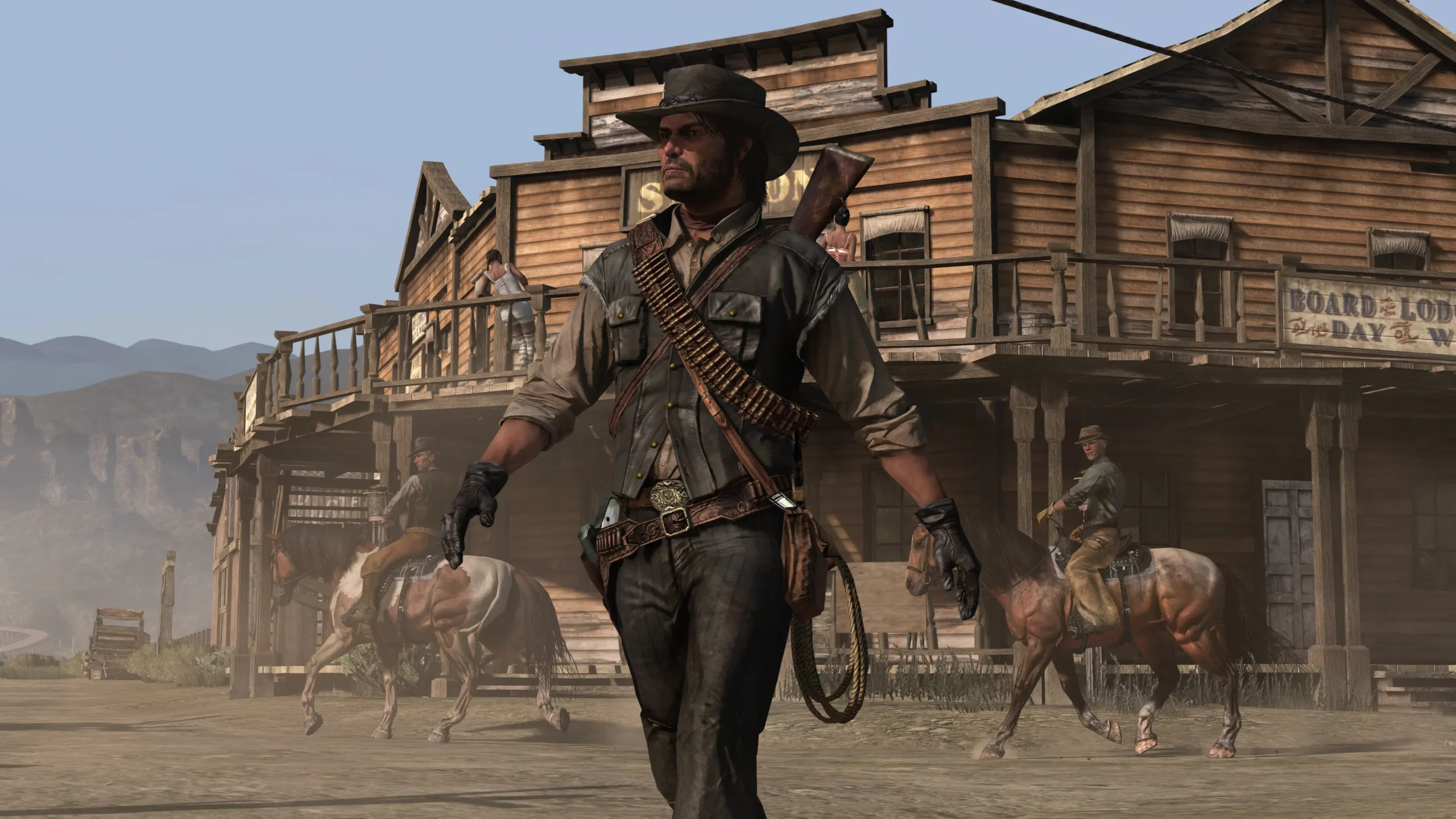 John Marston marchand devant le saloon d'Armadillo.