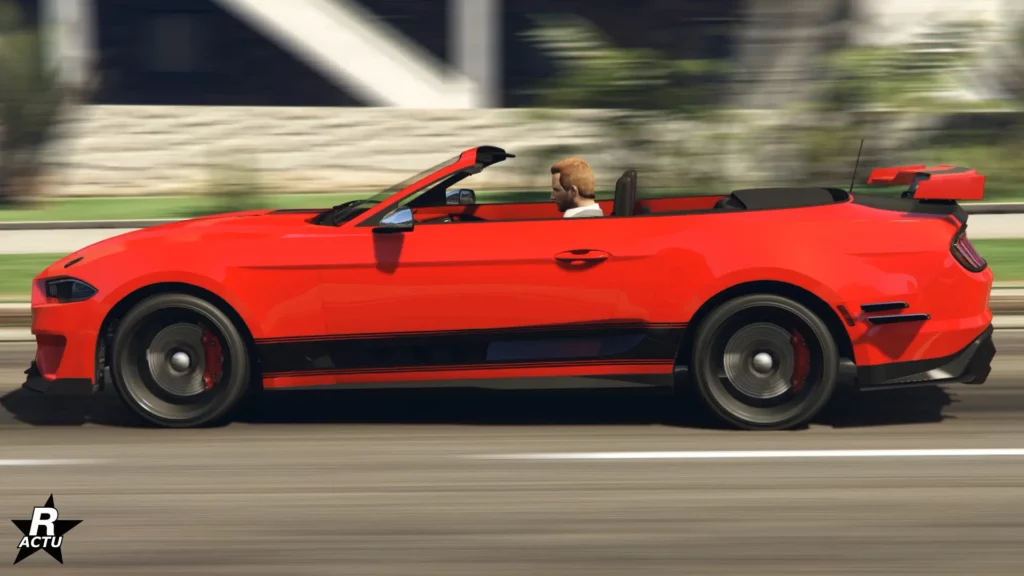 Vue latérale de la Vapid Dominator GT peinte en rouge.