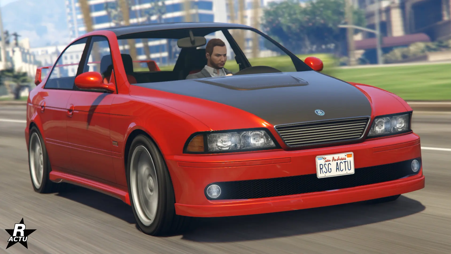 Vue avant de la voiture allemande Ubermacht Sentinel XS4 qui est peinte en rouge sur cette image. La berline présente également une décalcomanie recouvrant le capot et le toit avec un sticker gris anthracite.