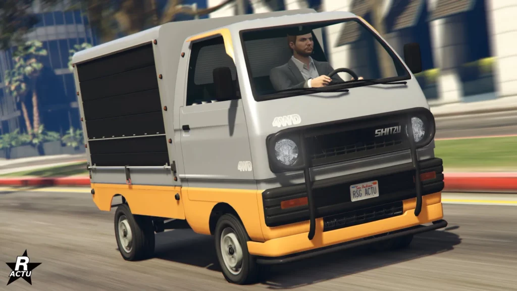 L'avant de la camionnette japonaise Shitzu Keitora peinte en gris et en jaune pour la partie du bas de caisse.