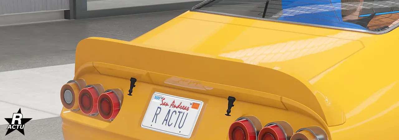 Aileron plat épousant les lignes de la carrosserie avec des arrondis aux extrémités.