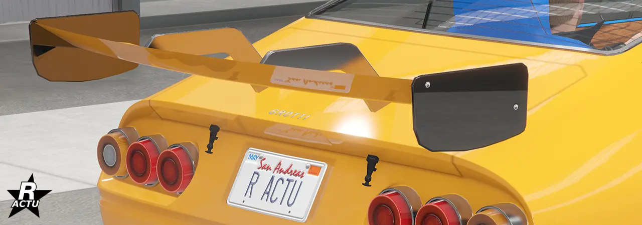 Grand aileron de course automobile avec fixation en acier et bord latéraux de couleur noir.