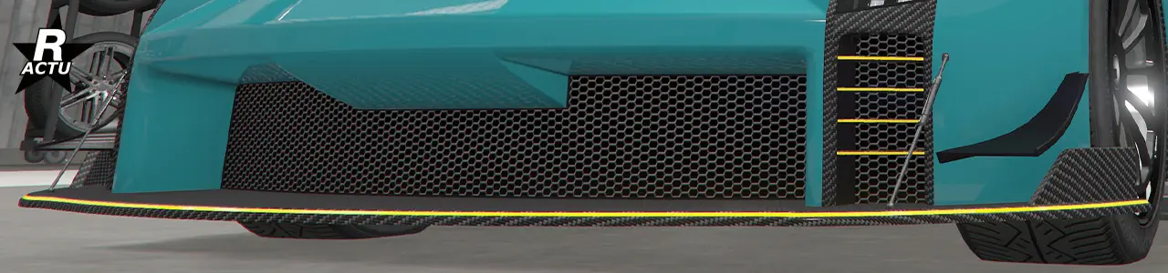 Séparateur ailé en carbone avec finitions couleur secondaire, et moustaches aérodynamiques de parte et d'autres du pare-chocs avant.