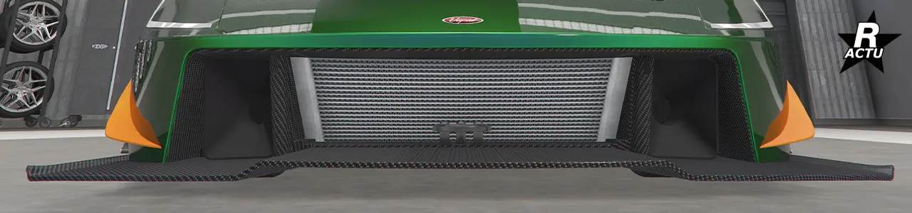 Simple ailette aérodynamique peinte dans la couleur secondaire de parte et d'autres du pare-chocs avant.