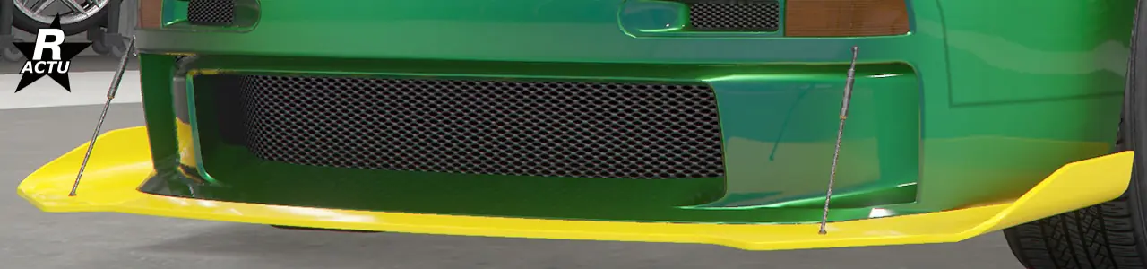 Séparateur aérodynamique aux bouts ailés couleur secondaire, et tiges de fixations en aluminium reliant le séparateur avec le haut du pare-chocs avant.