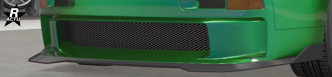 Petit séparateur aérodynamique avec encoche et ailes latérales en fibres de carbone sous le pare-chocs avant.