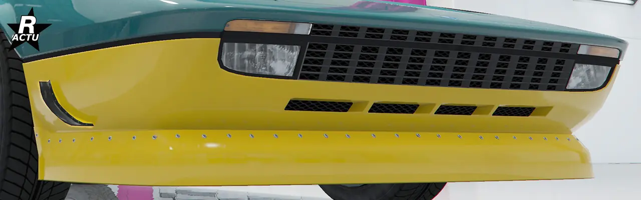 Séparateur étendu couleur secondaire visé sous le pare-chocs avant et moustaches aérodynamiques de parte et d'autres du pare-chocs.