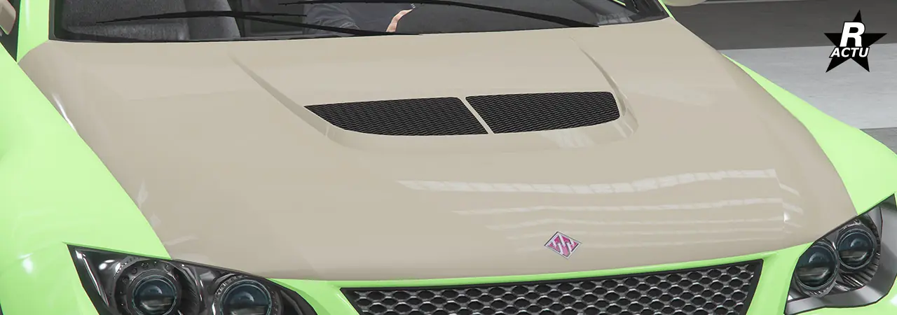 Capot de couleur secondaire, avec au milieu de celui-ci, une grand grille d'aération moteur rectangulaire, séparée d'une fine lamelle verticale en son centre.