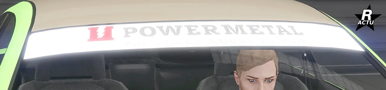 Vue rapprochée du pare-brise avant où l'option d'un pare-soleil blanc recouvre le haut du pare-brise et dispose de l'inscription "Power Metal" en noir avec son logo rouge sur le pare-soleil.