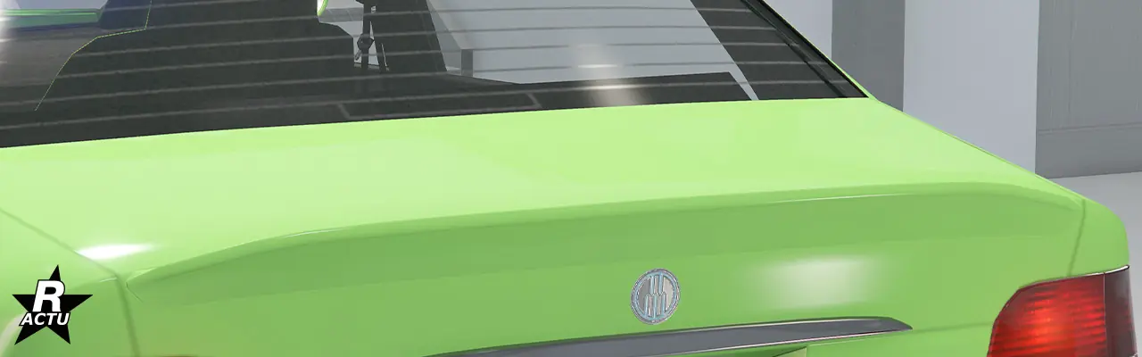 Aileron de taille moyenne en forme de bec de canard fixé à l'extrémité du coffre de la berline.