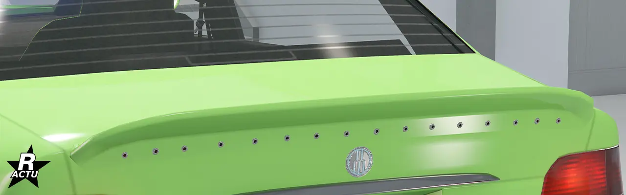 Aileron en forme de bec de canard vissé à l'extrémité du coffre.