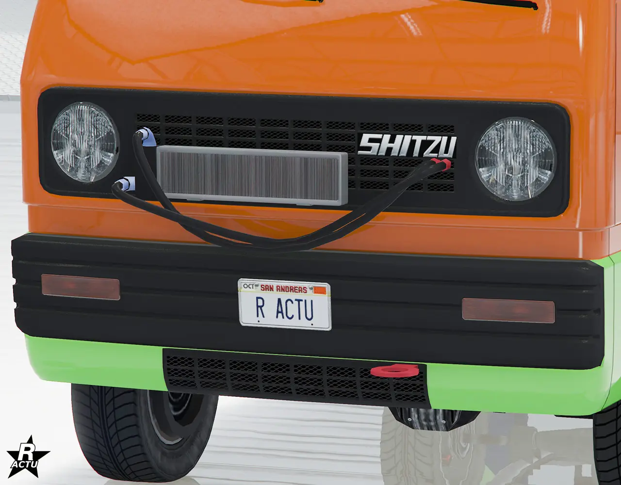 Option qui ajoute un radiateur d'huile moteur par-dessus la calandre et deux câbles d'alimentation qui pendouillent. Au niveau du pare-chocs avant du véhicule, un crochet de fixation rouge est apparent.