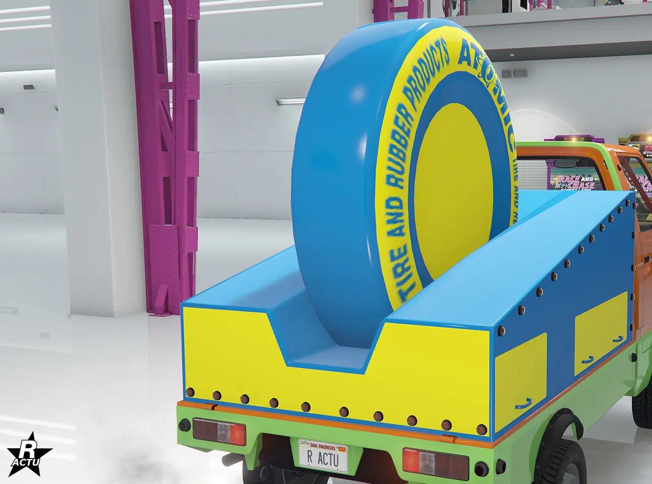 Option ajoutant un support bleu et jaune à la place du plateau arrière de la camionnette. Ce support est surmonté d'un pneu géant avec le logo de la compagnie de pneumatiques Atomix.