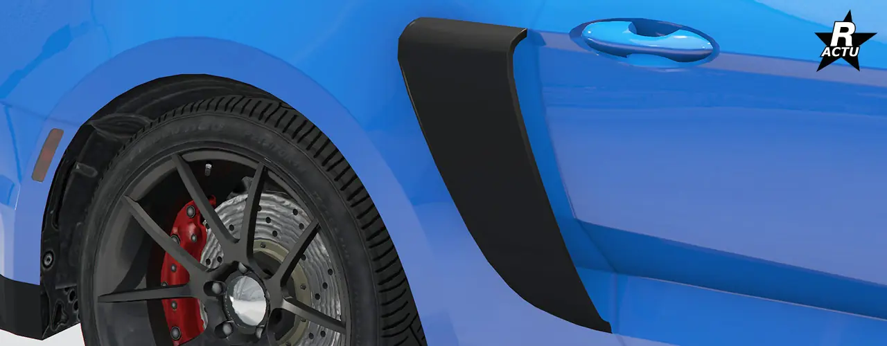 Aération de prise d'air latérale en plastique noir avec une ouverture verticale, se trouvant entre la porte et la roue arrière du véhicule.