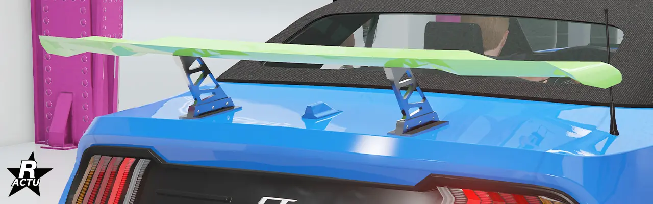 Option ajoutant un aileron de course aérodynamique de petite moyenne, peint dans la couleur secondaire avec ses attaches de fixations chromées, au-dessus du coffre de la grosse cylindrée.