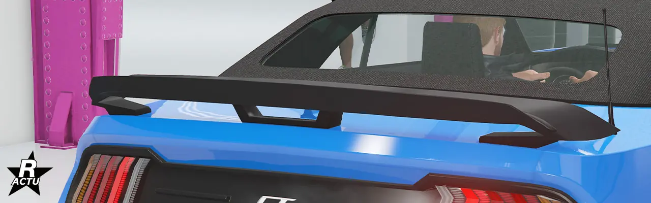 Option d'aileron aérodynamique surélevé au-dessus du coffre, en plastique noir.