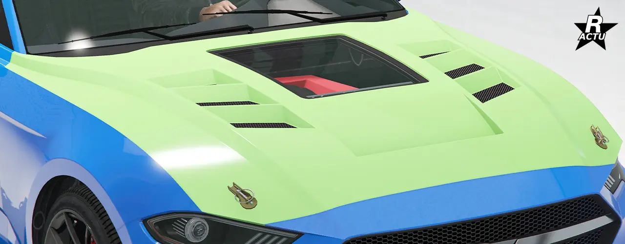 Option de capot peint dans la couleur secondaire, avec un alignement de 3 grilles d'aérations au niveau du côté droit et au niveau du côté gauche du capot, avec entre une vitre en verre donnant un visuel sur le moteur du véhicule. À l'avant du capot, une attache est présente de chaque côté.