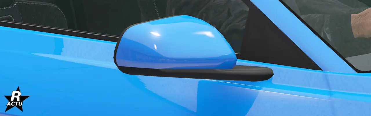 Rétroviseur couleur principale, fixé avec une attache noire sur la portière latérale passager.