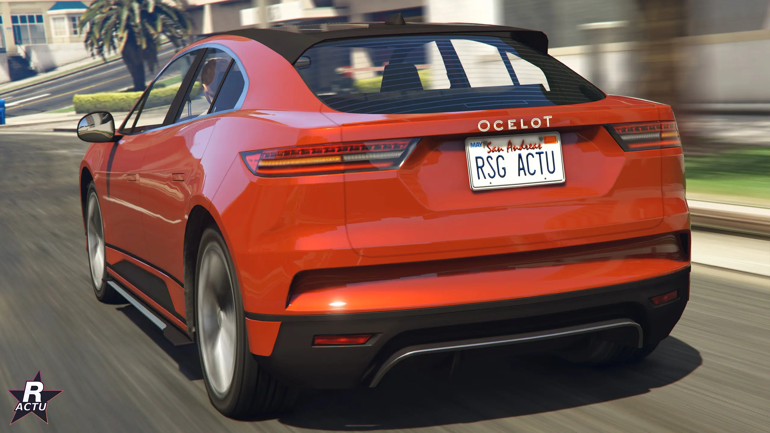 Arrière de l'Ocelot E-Stride orange : feux fins, badge Ocelot et diffuseur argenté