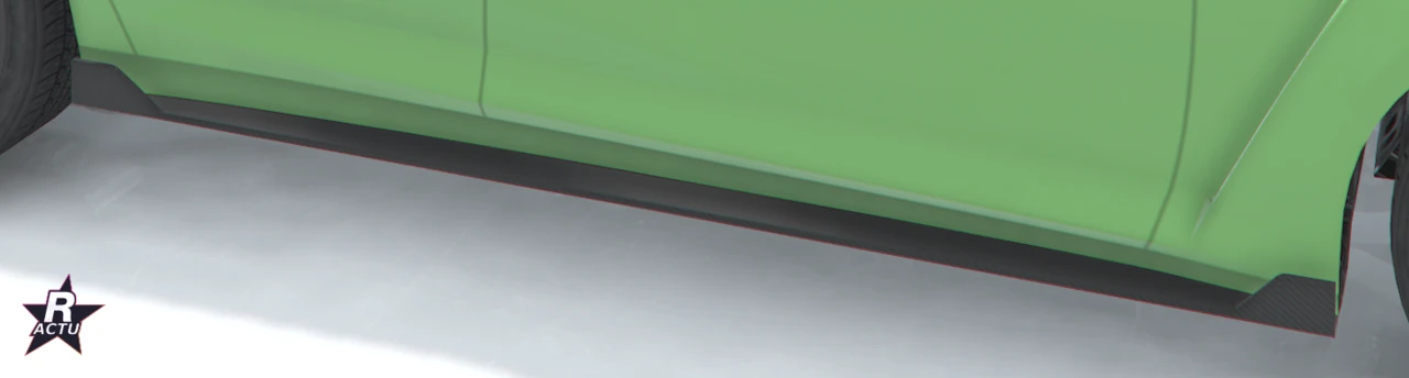 Bas de caisse course vert au profil affûté sous le flanc de la berline