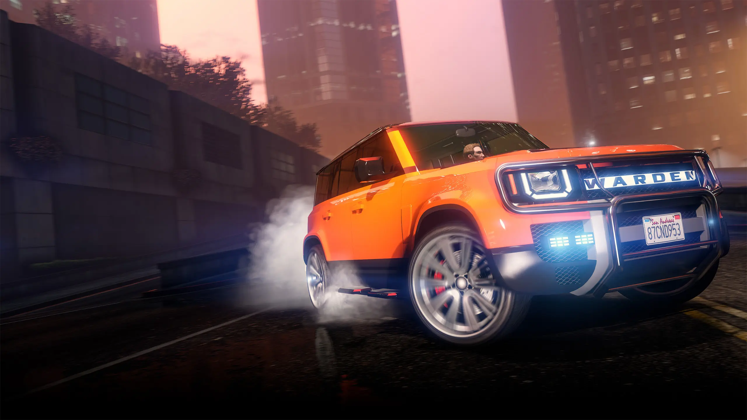 Image officielle de Rockstar Games pour le véhicule Gallivanter Warden, un SUV offert aux membres GTA+ en août 2026. Le véhicule est ici peint en orange, dans le centre d'affaires de Los Santos, vue de devant avec ses pneus  arrière qui font de la fumée.
