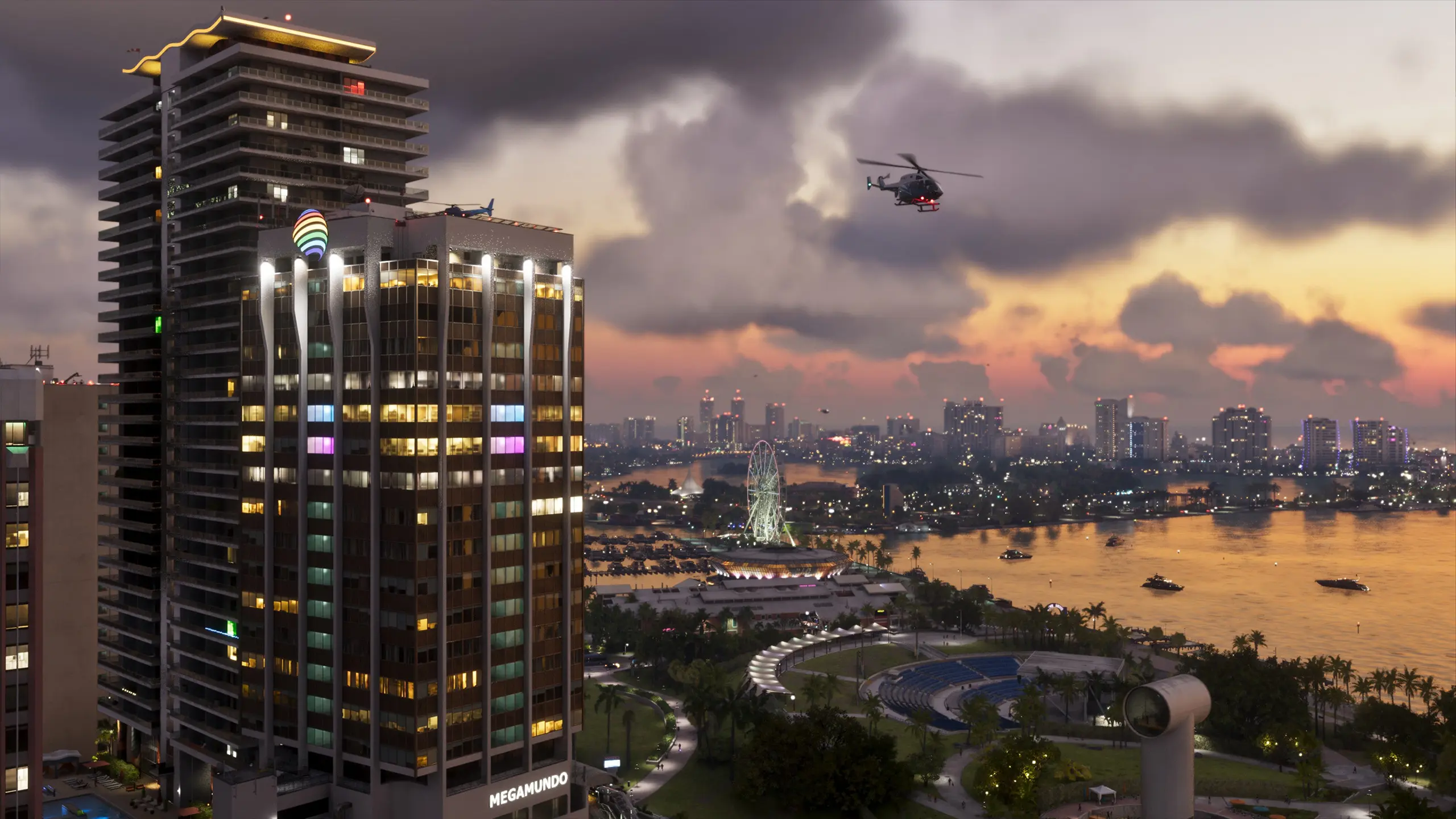 Vue de Vice City en soirée avec un hélicoptère qui survole le ciel.