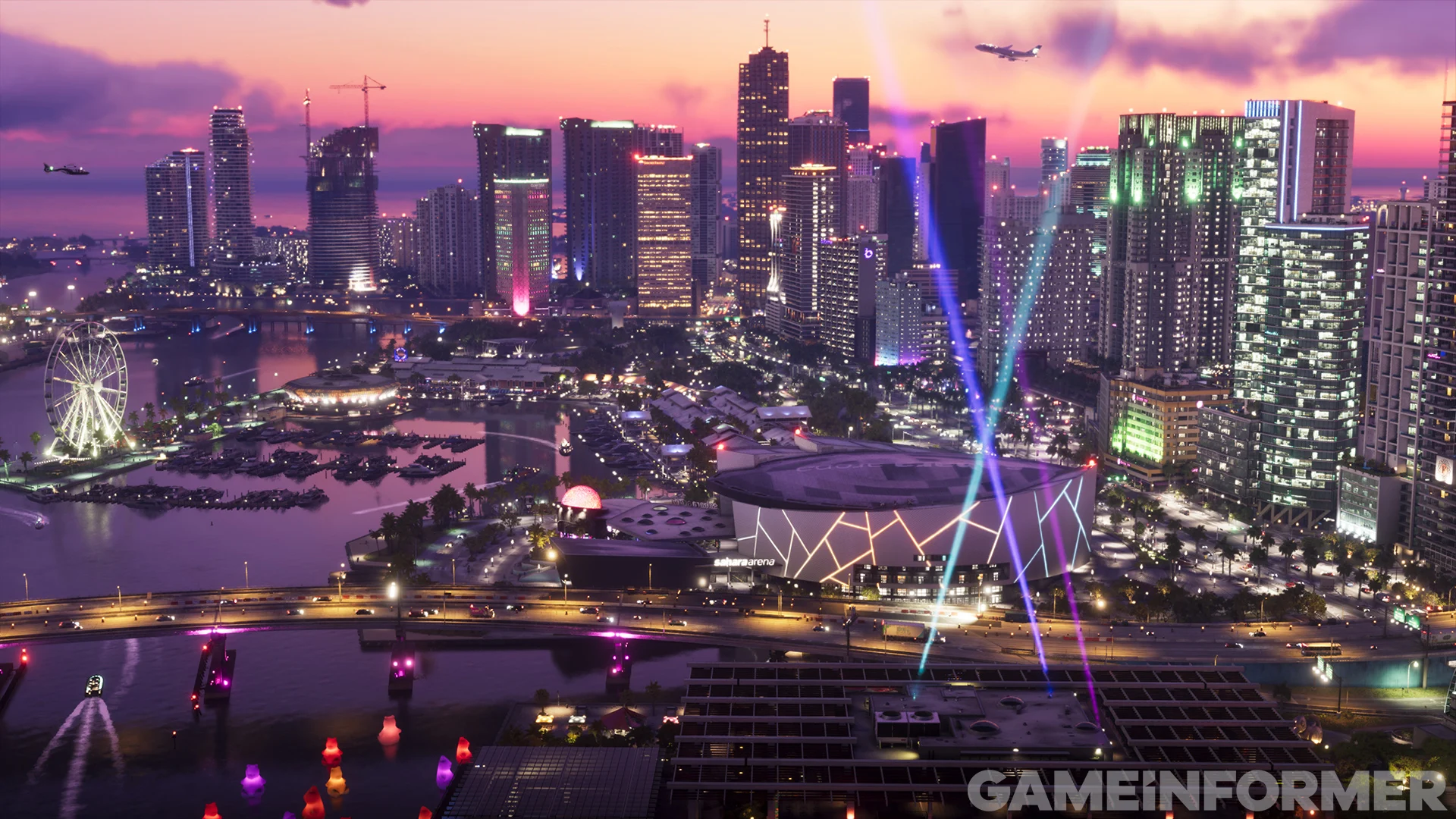 Ville de Vice City sous un ciel rose d'un couché de soleil.
