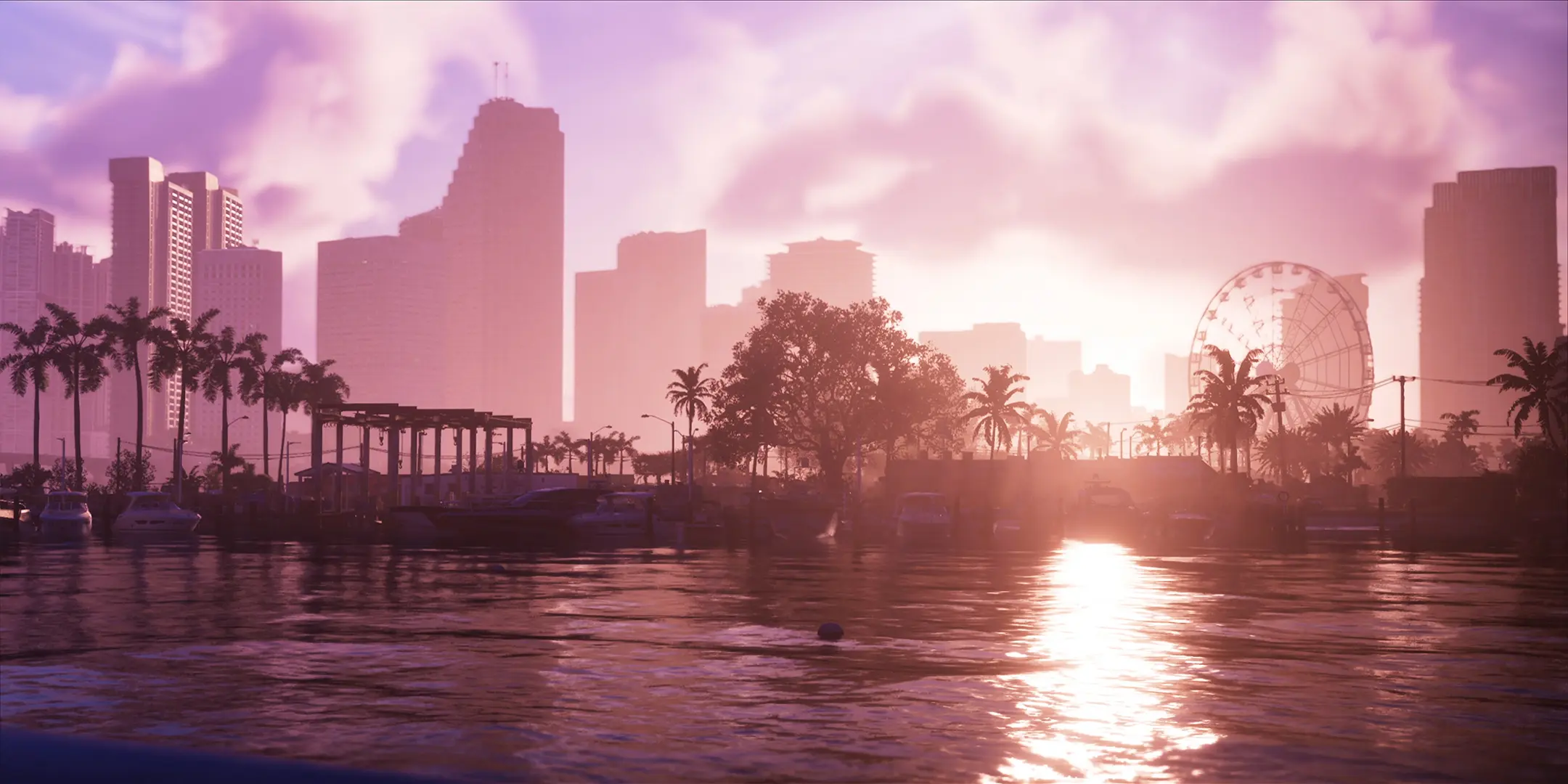 Vue depuis l'eau de la ville de Vice City, sous un levé de soleil rosé.